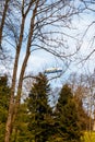 Blue dirigible flying in cloudy sky Royalty Free Stock Photo