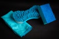 Blue dish washing sponge, blue cleaning brush and blue dust cloth Royalty Free Stock Photo