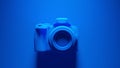 Blue DLSR Camera with Blue Background Royalty Free Stock Photo