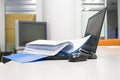 Blue Document folder with documents and Notebook on white table Royalty Free Stock Photo
