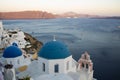 Blue dome church landmark view of a Mediterranean coastal landscape in Santorini