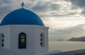 Blue dome of white church and clouds, Oia, Santorini, Greece Royalty Free Stock Photo