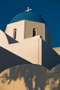 Blue dome of a white church at sunset, Oia village, Santorini island Royalty Free Stock Photo