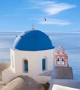 Blue Domed Anastasi Greek church in Oia town on Santorini island, Cyclades, Greece Royalty Free Stock Photo