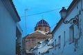 The blue domed church of the old town seen trough ancient alley in Altea, Costa Blanca, Spain Royalty Free Stock Photo