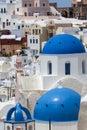 Blue domed churches on the Caldera at Oia on the Greek Island of Royalty Free Stock Photo