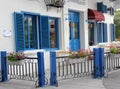 The blue door, blue window and blue railing