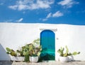 Blue door with cactus and white wall in the town of Ostuni with white buildings in Puglia Apulia region Royalty Free Stock Photo