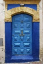 Blue door with fatima hand symbol