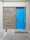 Blue Door Front View with copy space. Entrance View with Blue Door Interior with cement wall Royalty Free Stock Photo