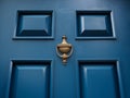 Blue door with knocker Royalty Free Stock Photo