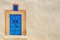 Blue door with national arabic pattern, copy space. Wall of a house in Sidi Bou Said, Tunisia Royalty Free Stock Photo