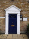 Blue door No.12 in old London houses in dockside