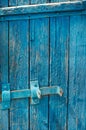 Blue Door of old boards with a latch Royalty Free Stock Photo