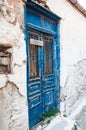 Blue door in old village in Greece Royalty Free Stock Photo