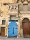Blue door with traditional signage in Valetta, Malta