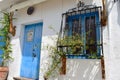 Blue door and window with art bars in Frigiliana, Spanish white village Andalusia