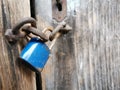 Blue Doorlock on old wooden door Royalty Free Stock Photo