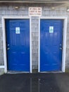 Blue doors, Buoys and Gulls Restroom signs Royalty Free Stock Photo