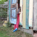 Blue doors and a girl in the village