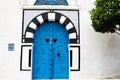 Blue doors and white wall of building in Sidi Bou Said, Tunisia. Royalty Free Stock Photo