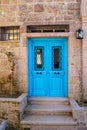 Blue double wooden door, well painted with windows Royalty Free Stock Photo