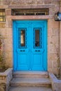 Blue double wooden door, well painted with windows Royalty Free Stock Photo