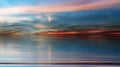 Blue dramatic Sunset at sea  orange gold lilac pink yellow blue colorful  clouds reflection on water wave ,dramatic fluffy clouds Royalty Free Stock Photo