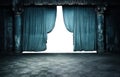 blue draped fabric cloth curtains on a post apocalyptic abandoned stage room. Royalty Free Stock Photo