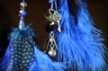 Blue dream catcher hanging on dark background with suspension key and heart Royalty Free Stock Photo