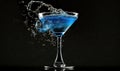 a blue drink is being poured into a martini glass with a splash of water Royalty Free Stock Photo