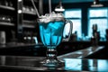 a blue drink in a glass with ice and straws