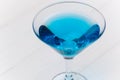 Blue drink in transparent coctail glass close-up