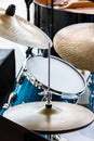 blue drum and copper cymbals standing in street for musical performance