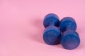 Blue dumbells on the pink