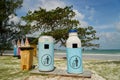 Blue dustbin by the beach Royalty Free Stock Photo