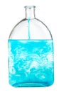 Blue dye dissolves in water in flask isolated Royalty Free Stock Photo