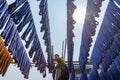 Blue dyed silk hanging in fabric weaving factory in Amarapura Myanmar