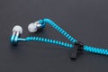 Blue earphone and cable line like zipper Royalty Free Stock Photo