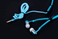 blue earphone and cable like zipper Royalty Free Stock Photo