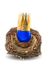 Blue easter egg with golden crown decoration