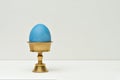 Blue easter egg on stand