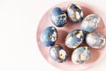 Blue easter eggs decorated gold patel on the pink plate. Free space for text Royalty Free Stock Photo