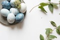 Blue Easter eggs on tin plate, decorated with flowers Royalty Free Stock Photo
