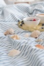 Blue ecologycal linen on bed in modern home interior. Daylight Royalty Free Stock Photo