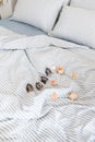 Blue ecologycal linen on bed in modern home interior. Daylight Royalty Free Stock Photo