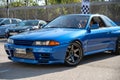 blue eighth-generation Nissan Skyline GT R32 at a Japanese sports car meet. Royalty Free Stock Photo