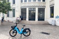 Blue electric bike parked on the street in Lisbon, Portugal