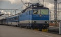 Blue electric engine with fast train to Prague arriving from Pilsen main station Royalty Free Stock Photo