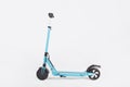 Blue electric kick scooter with seat on white background, side view Royalty Free Stock Photo